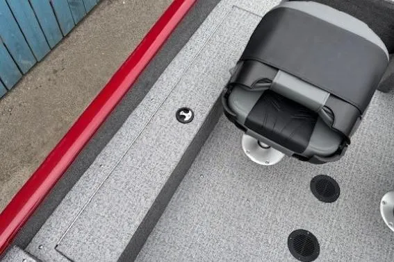 Slide: The Image of 2021 Tracker Super Guide V-16 SC boat interior with seat and storage compartment. - 16