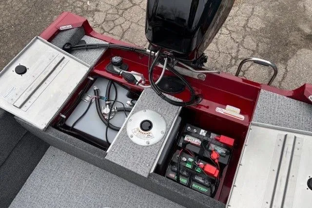 Slide: The Image of 2021 Tracker Super Guide V-16 SC boat interior showing battery and fuel compartments. - 19