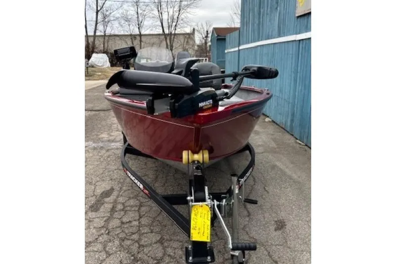 Slide: The Image of 2021 Tracker Super Guide V-16 SC boat on trailer, parked outdoors. - 2