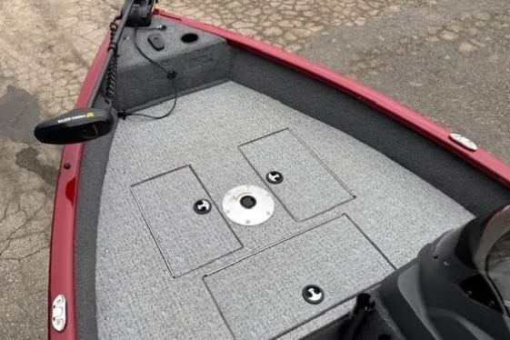 Slide: The Image of 2021 Tracker Super Guide V-16 SC boat deck with storage compartments and trolling motor. - 8