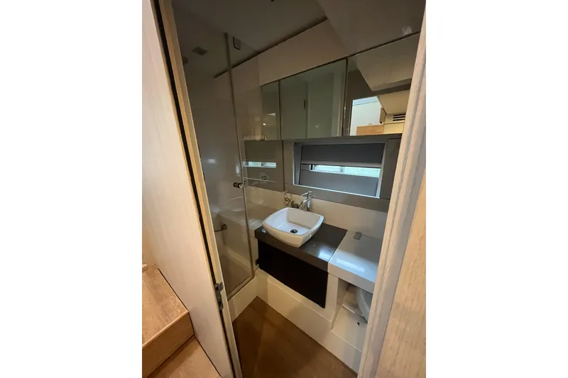 Slide: The Image of Bathroom interior of 2012 Fairline Targa 58 Gran Turismo yacht, featuring modern sink and mirror. - 14