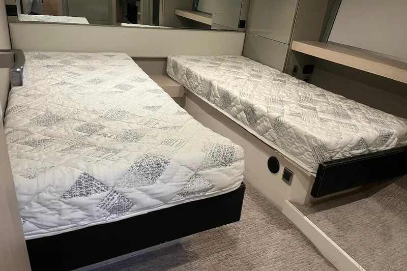 Slide: The Image of Twin beds in a 2012 Fairline Targa 58 Gran Turismo yacht cabin. - 16