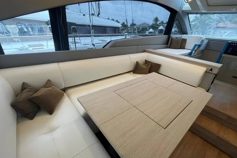Slide: The Image of Luxurious interior of 2012 Fairline Targa 58 Gran Turismo yacht with elegant seating and table. - 6