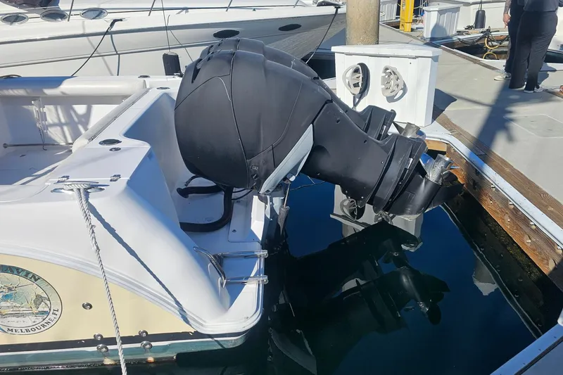 Slide: The Image of 2006 Pro-Line 32 Express boat with outboard motor docked at marina. - 1