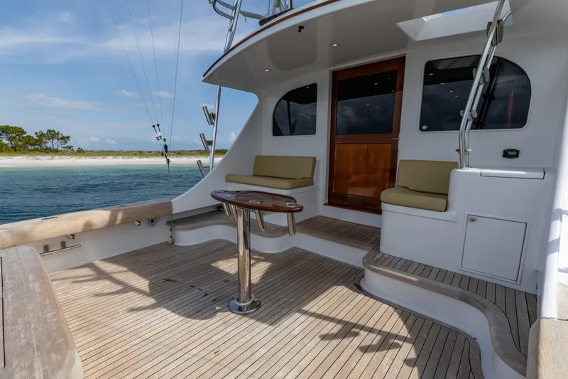 Slide: The Image of 2000 Custom Carolina Alex Willis Convertible yacht deck with seating and ocean view. - 17