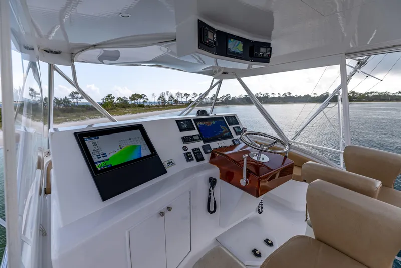 Slide: The Image of Helm of 2000 Custom Carolina Alex Willis Convertible with navigation screens and steering wheel. - 22