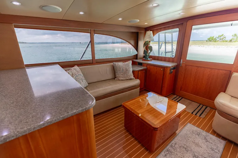 Slide: The Image of Luxurious interior of 2000 Custom Carolina Alex Willis Convertible yacht with ocean view. - 5