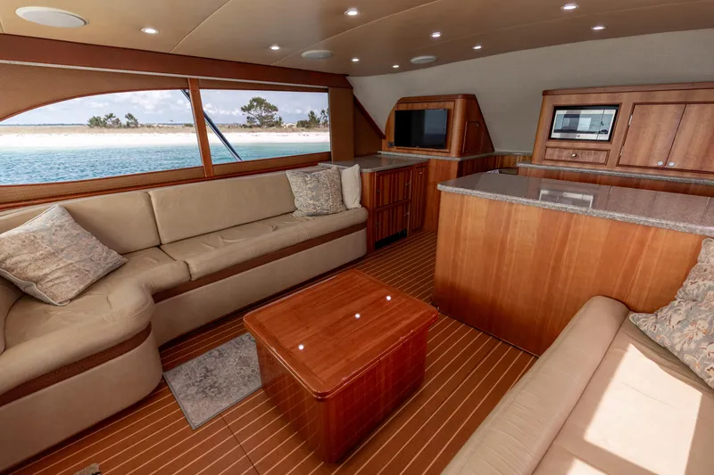 Slide: The Image of Luxurious interior of 2000 Custom Carolina Alex Willis Convertible yacht with elegant wood finishes. - 6