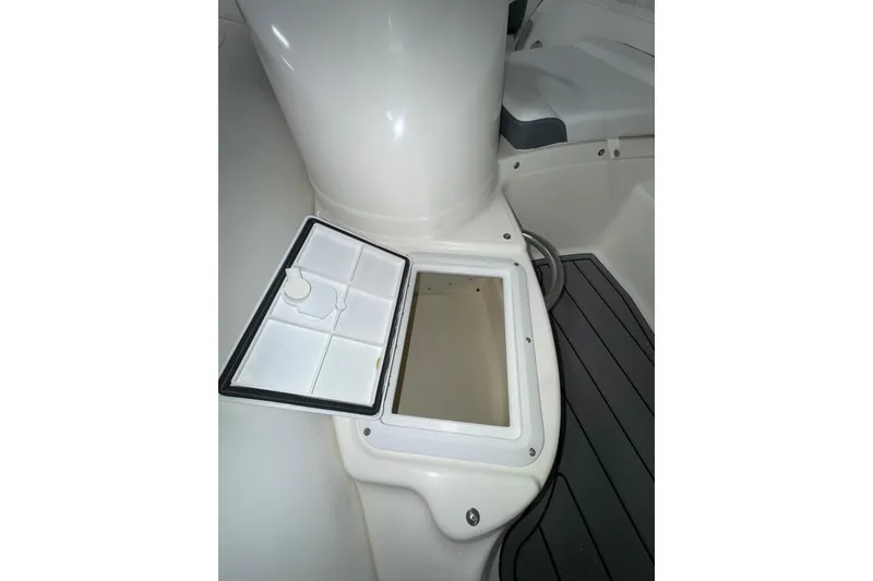 Slide: The Image of Open storage compartment on 2026 Zodiac Yachtline 400 boat deck. - 10