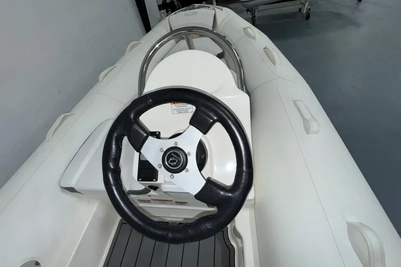 Slide: The Image of 2026 Zodiac Yachtline 400 steering wheel and console, featuring sleek design and modern controls. - 3