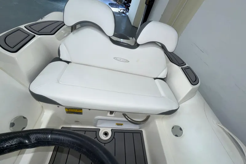 Slide: The Image of 2026 Zodiac Yachtline 400 boat interior with white cushioned seating and sleek design. - 4