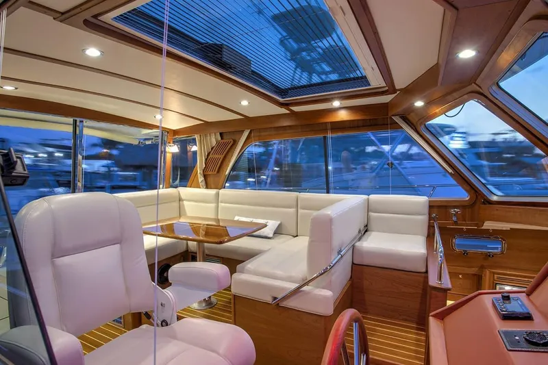 Slide: The Image of Luxurious interior of 2027 Sabre 38 Salon Express yacht with elegant seating and wood finishes. - 11