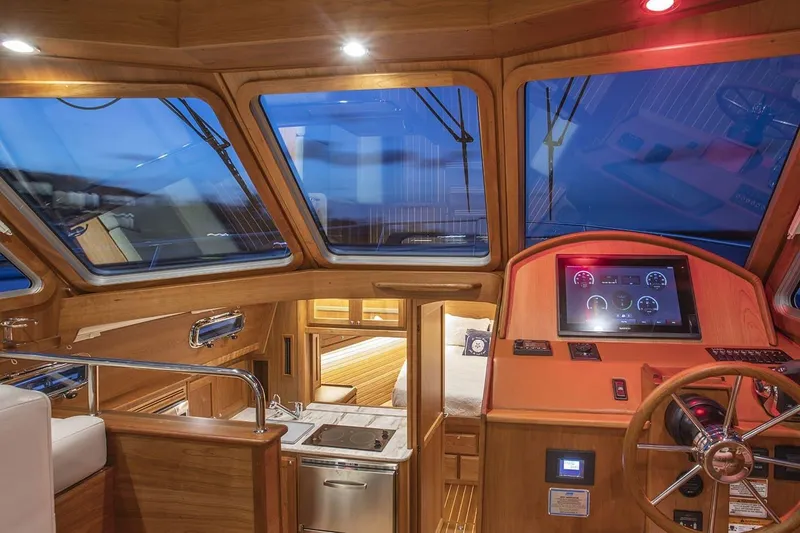 Slide: The Image of Interior of 2027 Sabre 38 Salon Express yacht with modern helm and luxurious cabin. - 14