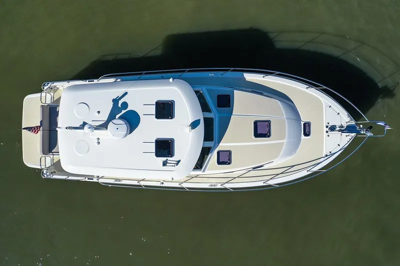 Slide: The Image of Aerial view of 2027 Sabre 38 Salon Express yacht on calm water. - 2