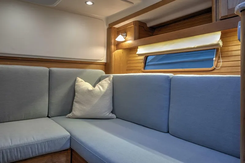 Slide: The Image of 2027 Sabre 38 Salon Express interior with cozy seating and soft lighting. - 7
