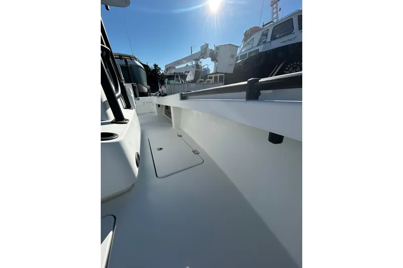 Slide: The Image of 2017 Baker Boatworks 26 Open deck view under bright sunlight. - 10