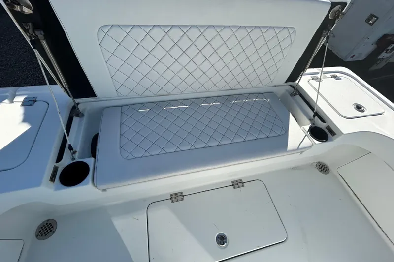 Slide: The Image of 2017 Baker Boatworks 26 Open with cushioned seating and storage compartments. - 13