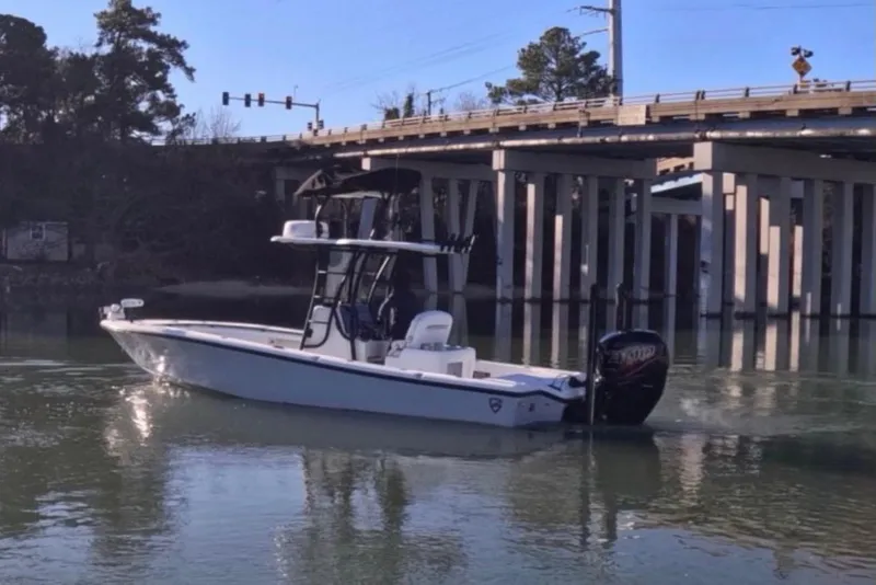 Slide: The Image of 2017 Baker Boatworks 26 Open on calm water near a bridge. - 15