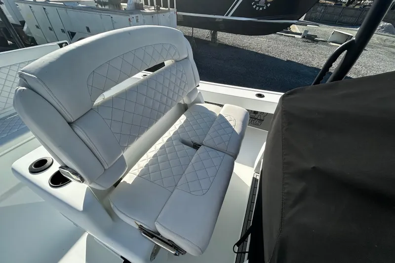 Slide: The Image of 2017 Baker Boatworks 26 Open with white quilted seating and cup holders. - 7