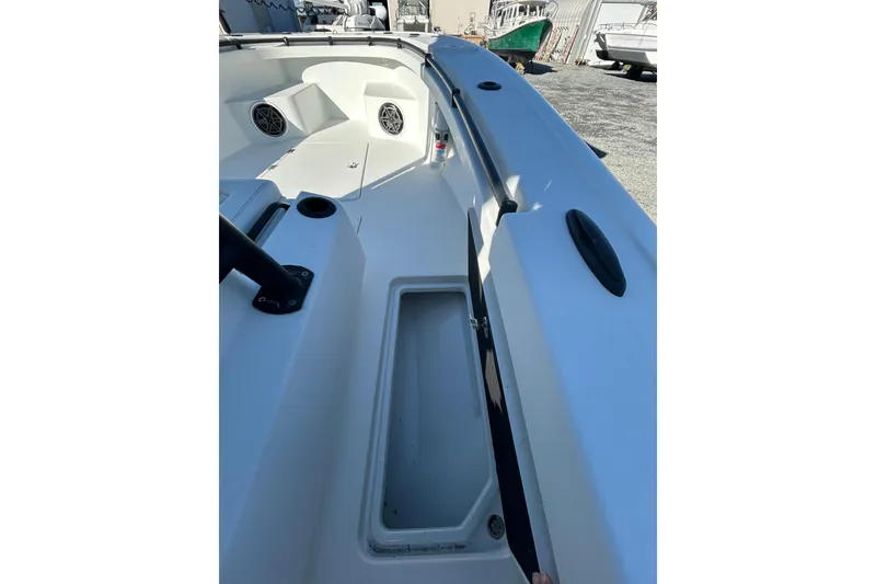 Slide: The Image of 2017 Baker Boatworks 26 Open deck view with storage compartment and speakers. - 9