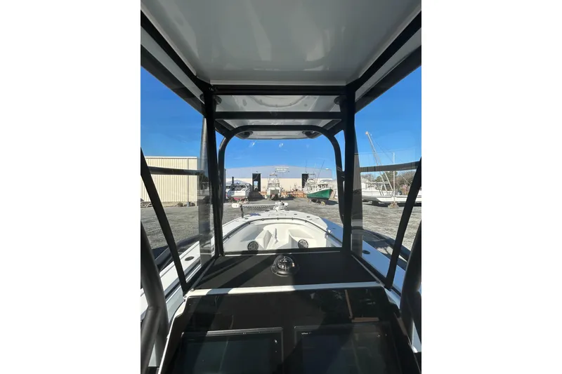 Slide: The Image of Interior view of 2017 Baker Boatworks 26 Open, showcasing helm and windshield. - 6