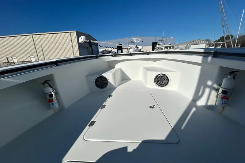 Slide: The Image of 2017 Baker Boatworks 26 Open deck with fire extinguishers and storage compartments. - 8