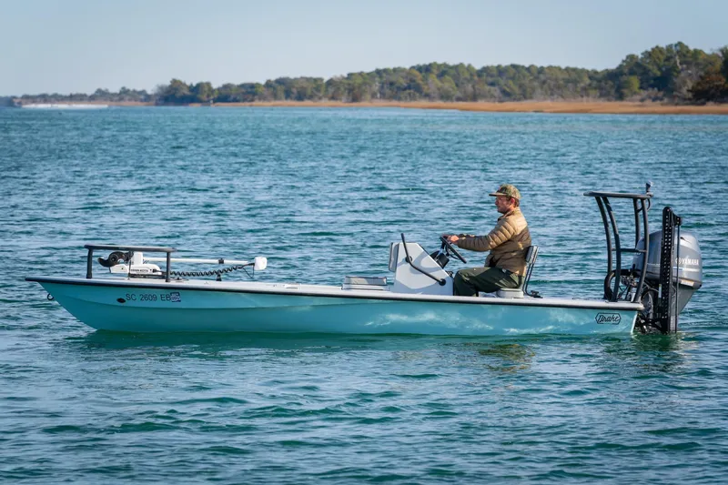 The Image of Man piloting 2021 Drake Nomad boat on calm water. - 0
