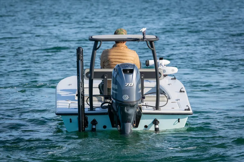 Slide: The Image of 2021 Drake Nomad boat with Yamaha engine on calm water. - 5