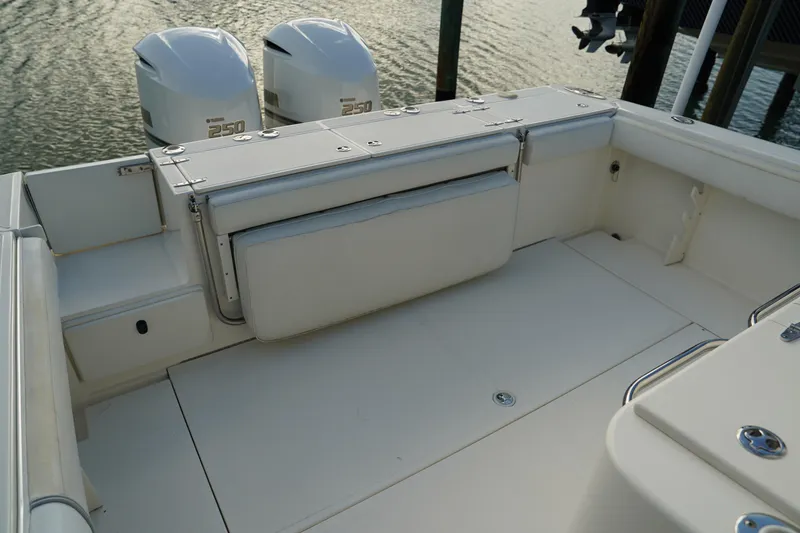 Slide: The Image of 2013 Stamas 317 Tarpon boat interior with Yamaha 250 engines, featuring spacious seating. - 10