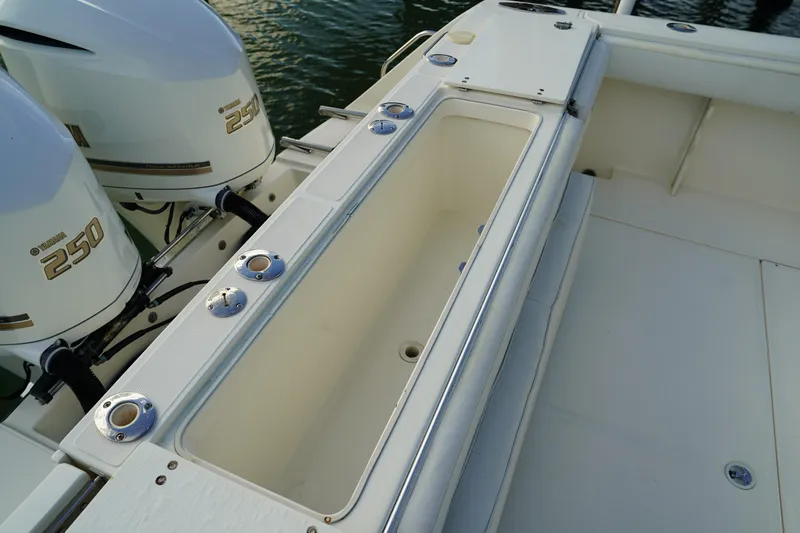Slide: The Image of 2013 Stamas 317 Tarpon boat with Yamaha 250 engines, featuring a spacious deck area. - 11