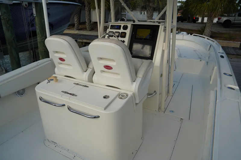 Slide: The Image of 2013 Stamas 317 Tarpon boat interior with dual seats and navigation console. - 16