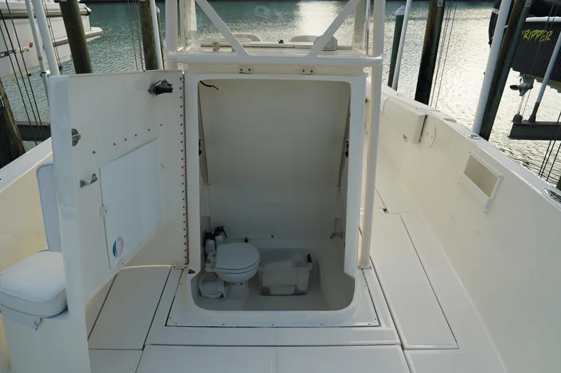Slide: The Image of 2013 Stamas 317 Tarpon boat interior with open hatch and marine toilet. - 28
