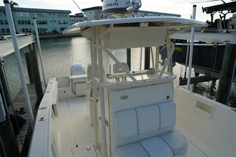Slide: The Image of 2013 Stamas 317 Tarpon boat docked, featuring spacious seating and modern design. - 29
