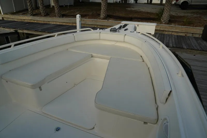 Slide: The Image of 2013 Stamas 317 Tarpon boat interior with cushioned seating and deck view. - 33