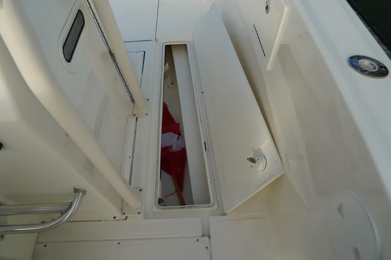 Slide: The Image of 2013 Stamas 317 Tarpon boat storage compartment with open hatch. - 36