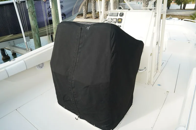 Slide: The Image of 2013 Stamas 317 Tarpon boat with covered console, docked near wooden posts. - 37