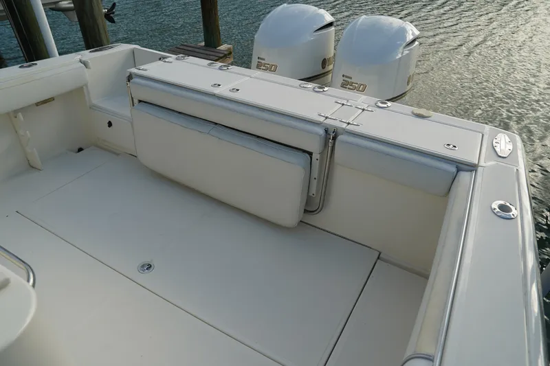 Slide: The Image of 2013 Stamas 317 Tarpon boat with dual 250 engines, featuring spacious deck seating. - 9