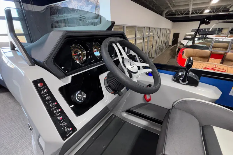 Slide: The Image of 2026 Viaggio Z24U boat dashboard with steering wheel and control panel in showroom. - 27