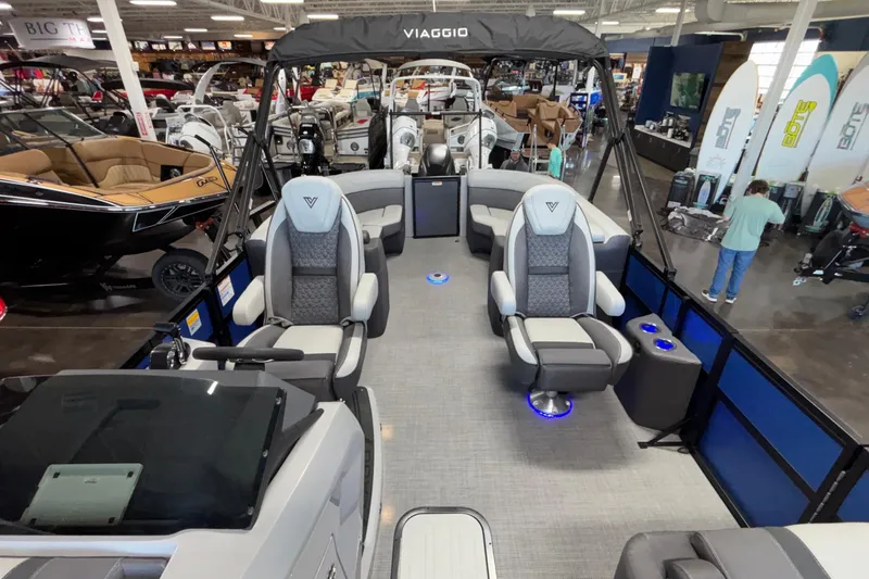 Slide: The Image of 2026 Viaggio Z24U pontoon boat interior with luxury seating and modern design in showroom. - 22