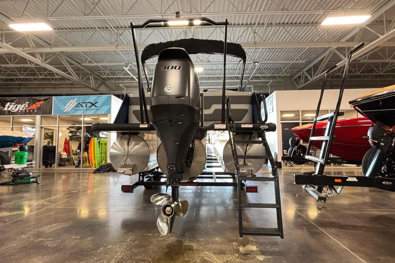 Slide: The Image of 2026 Viaggio Z24U pontoon boat with powerful 300 HP engine in showroom. - 46