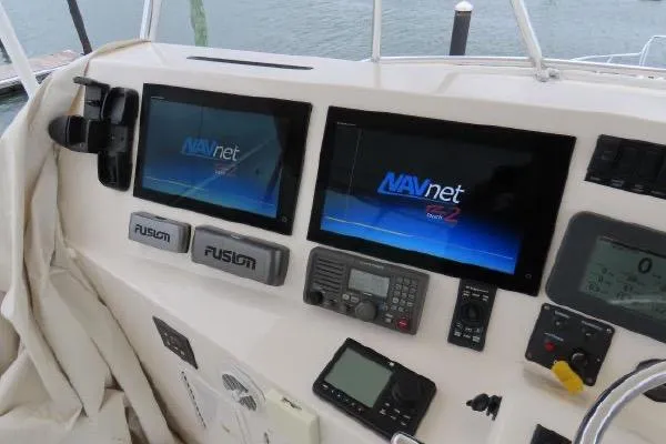 Slide: The Image of Control panel of 2011 Henriques 42 Flybridge with NAVnet screens and Fusion audio system. - 22