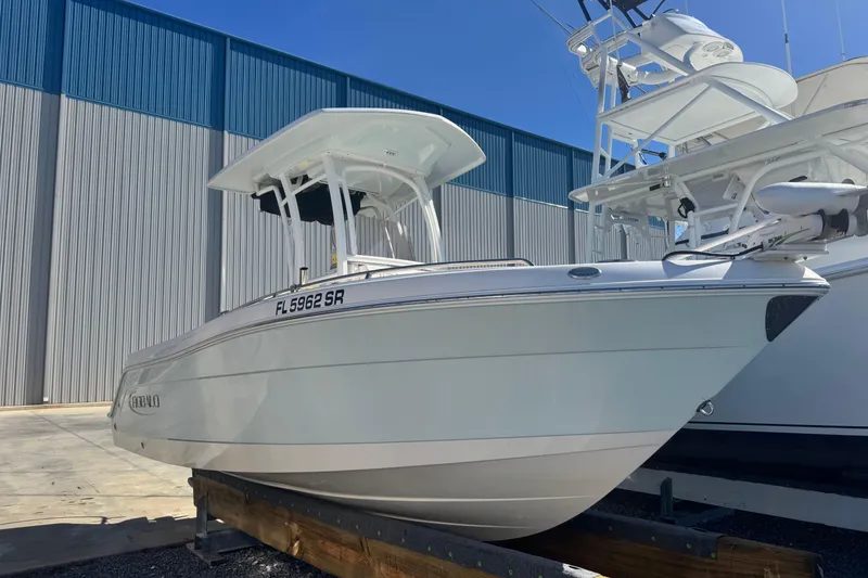 The Image of 2020 Robalo R222 Center Console boat on display in a marina setting. - 1