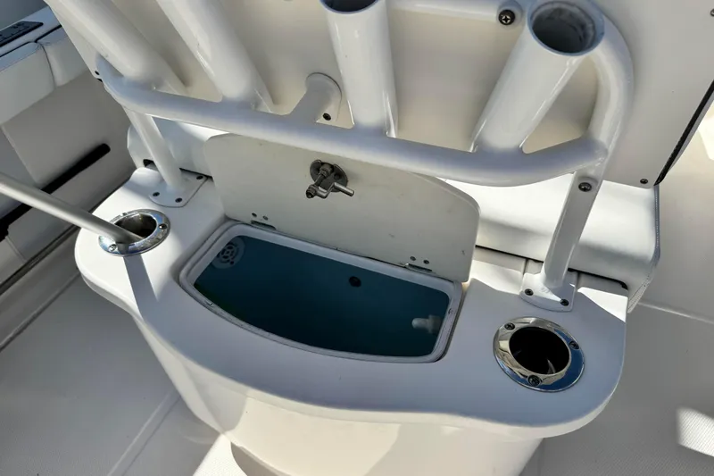Slide: The Image of 2020 Robalo R222 Center Console boat with rod holders and livewell. - 10