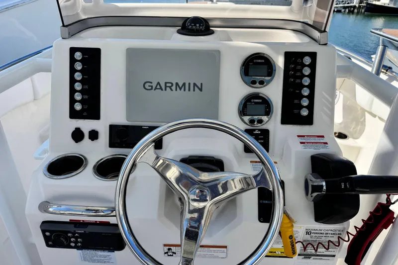 Slide: The Image of 2020 Robalo R222 Center Console dashboard with Garmin display and controls. - 12