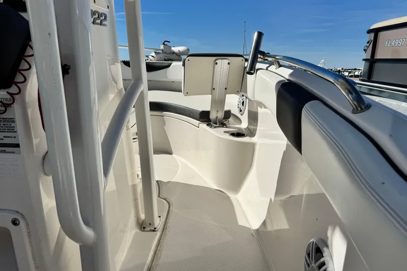 Slide: The Image of 2020 Robalo R222 Center Console boat interior with seating and railing. - 14