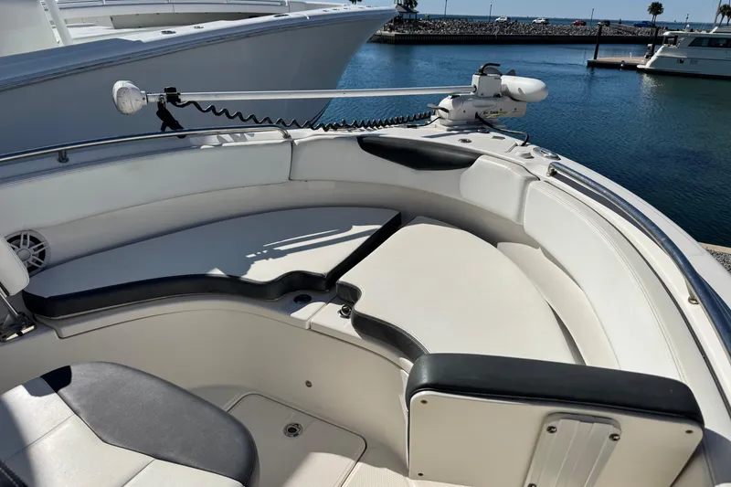 Slide: The Image of 2020 Robalo R222 Center Console boat interior with seating and water view. - 15