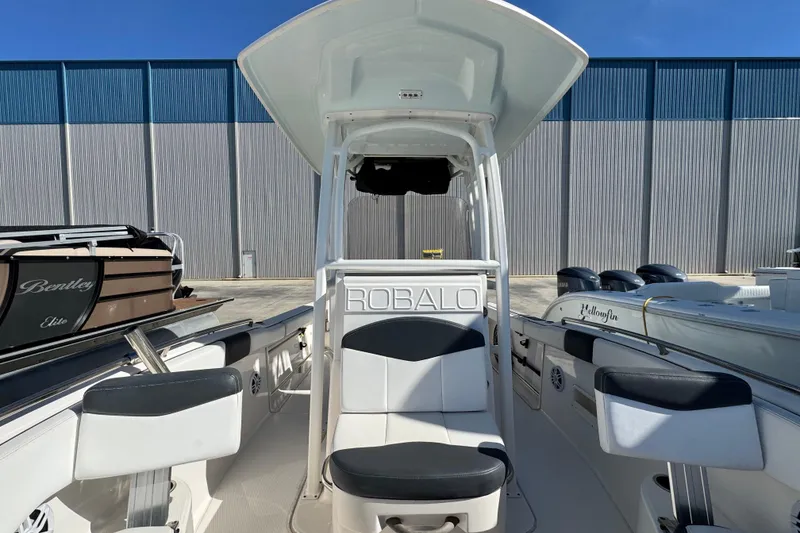 Slide: The Image of 2020 Robalo R222 Center Console boat interior with seating and console view. - 17