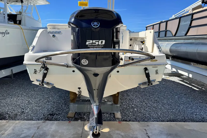 Slide: The Image of 2020 Robalo R222 Center Console boat with Yamaha 250 engine, docked on gravel. - 5