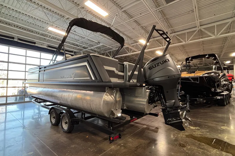 Slide: The Image of 2026 Viaggio Z24U pontoon boat with Suzuki outboard motor in showroom. - 3