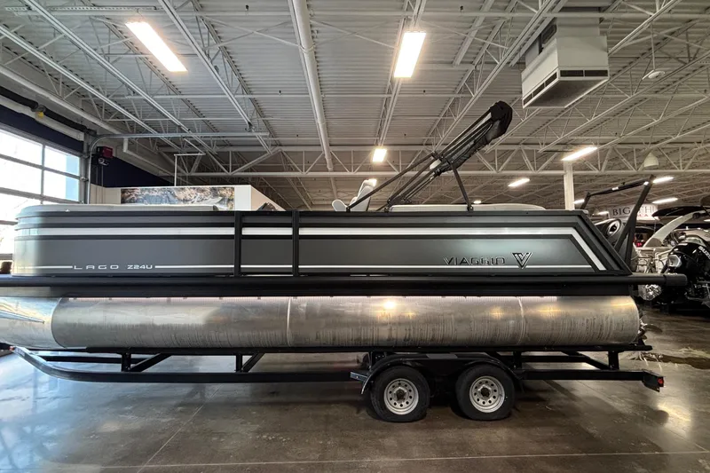 The Image of 2026 Viaggio Z24U pontoon boat displayed indoors on a trailer. - 1